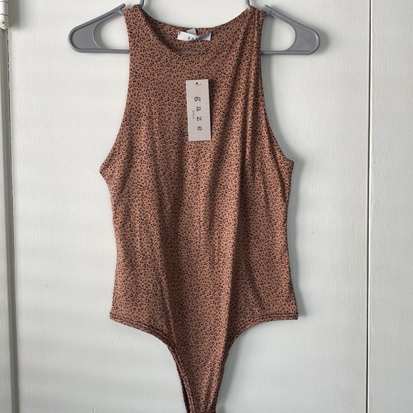 gaze Tops - Leopard print bodysuit, new with tags never worn